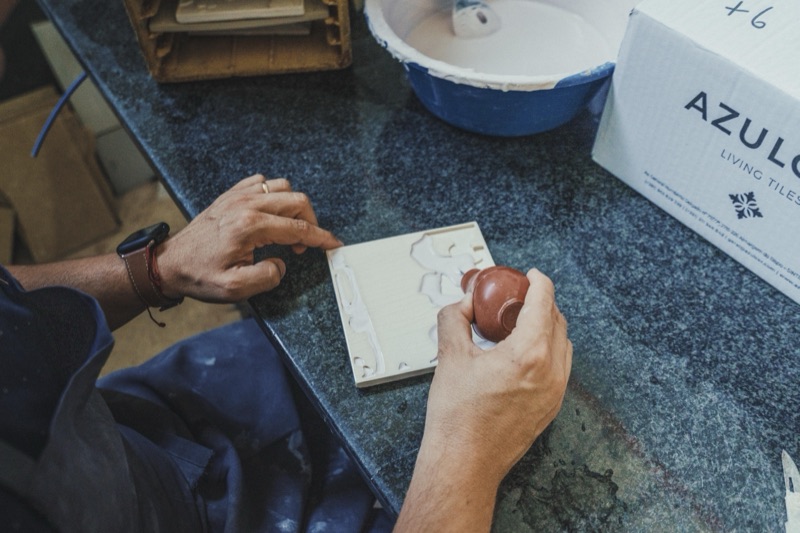 Hand-working a tile mould at the bench