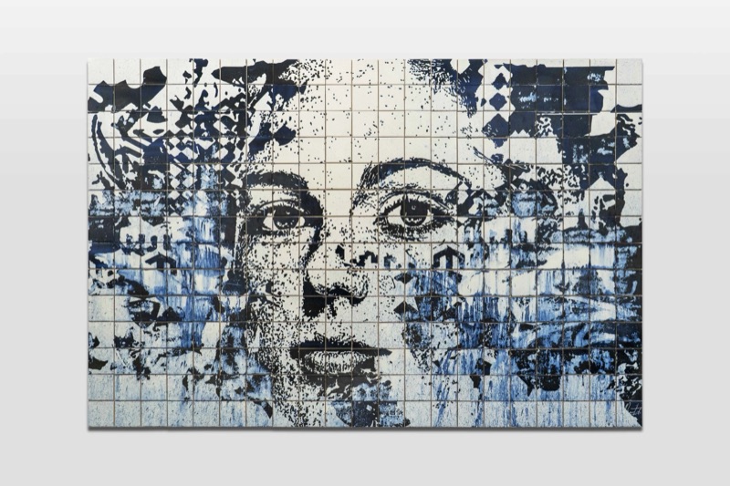 Carved blue-and-white azulejo portrait panel by Vhils