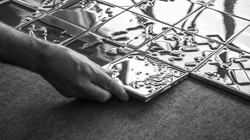 Production still of a Vhils azulejo panel being worked