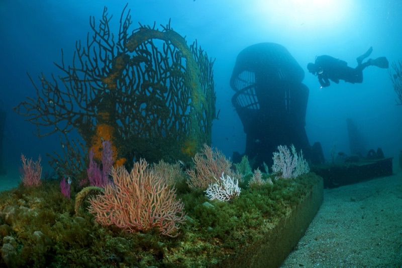 Divers at the EDP Art Reef carved sculptures off Albufeira