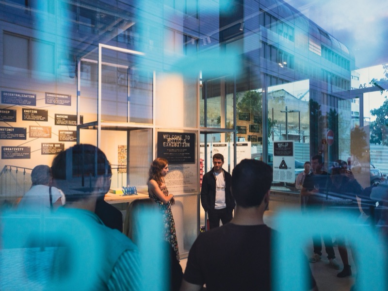 Botto exhibition seen through the Marvila facade at dusk