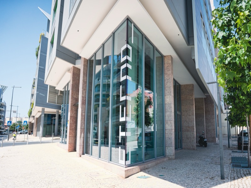 Eterno gallery glass corner facade with vertical ETERNO lettering, opening day, Prata Riverside, Marvila