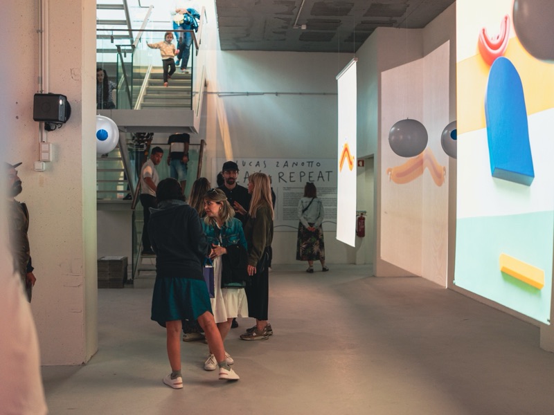PLAY+REPEAT — Lucas Zanotto, immersive projection space with visitors at the opening