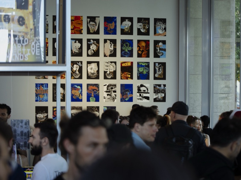 Unpermissioned Self: Proof of Being — opening crowd before the portrait print grid wall
