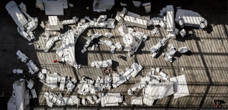 Aerial view of the carved styrofoam vehicles at Le Centquatre-Paris