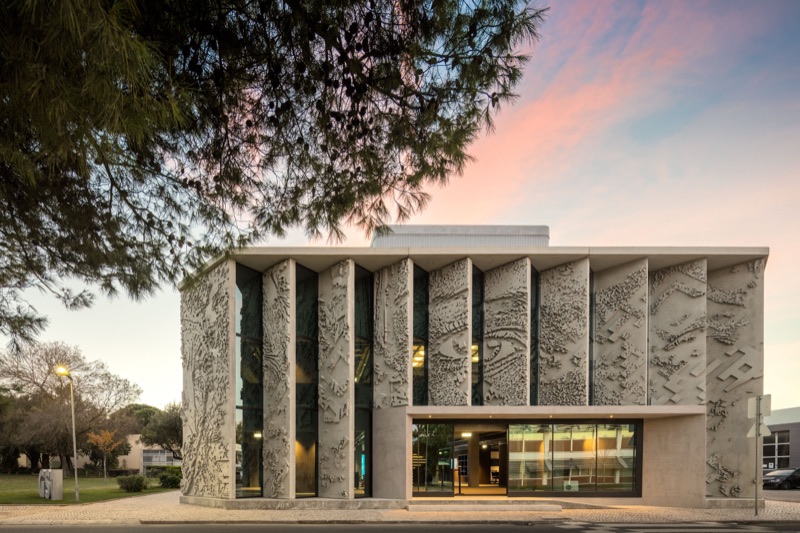 GS1 Portugal HQ carved facade at dusk
