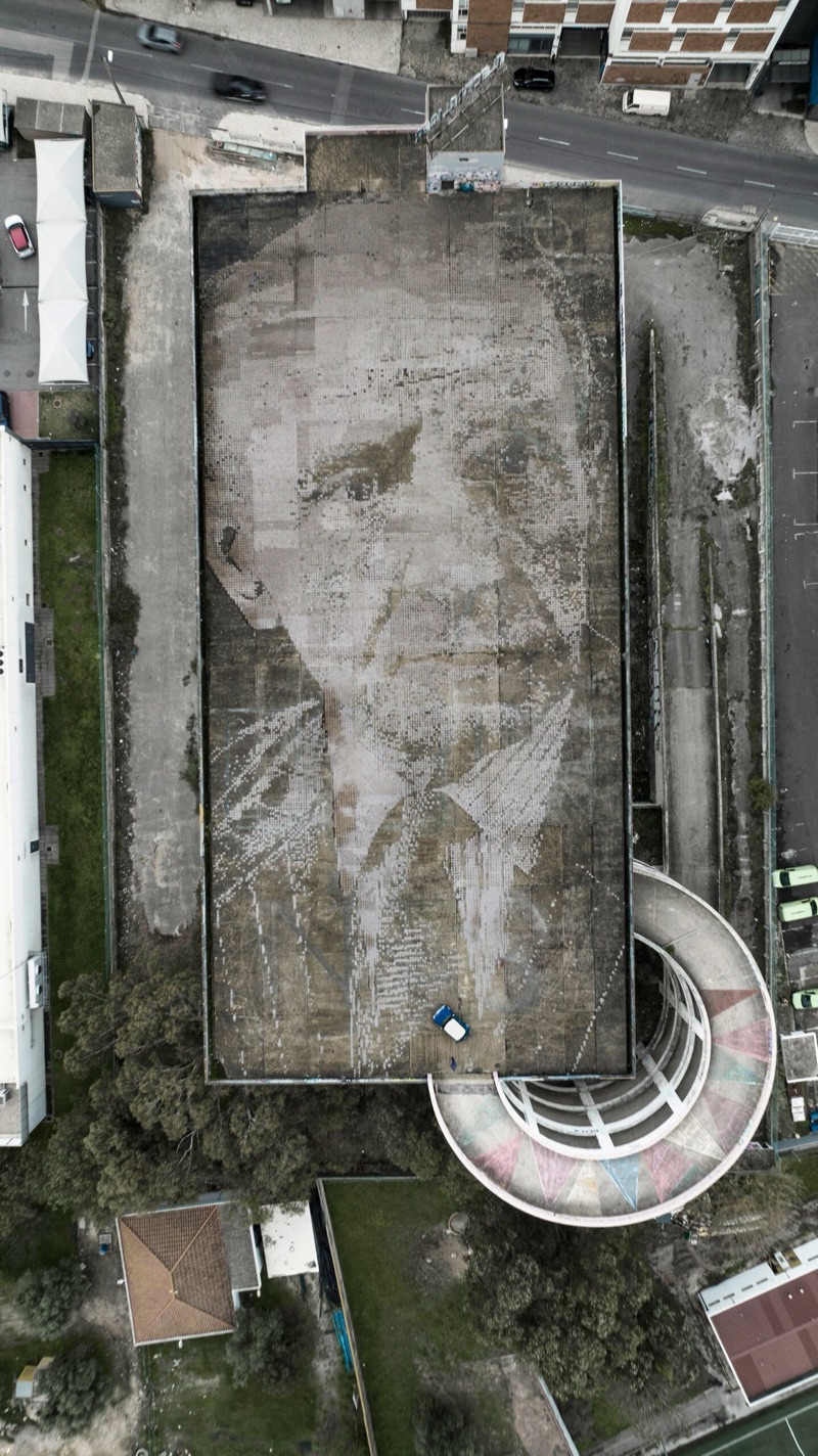 MINI x Vhils Urban Canvas - top-down drone of the rooftop portrait