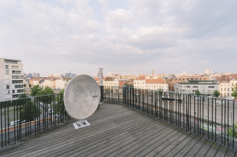 Rooftop carved disc over the Brussels skyline — Multitude