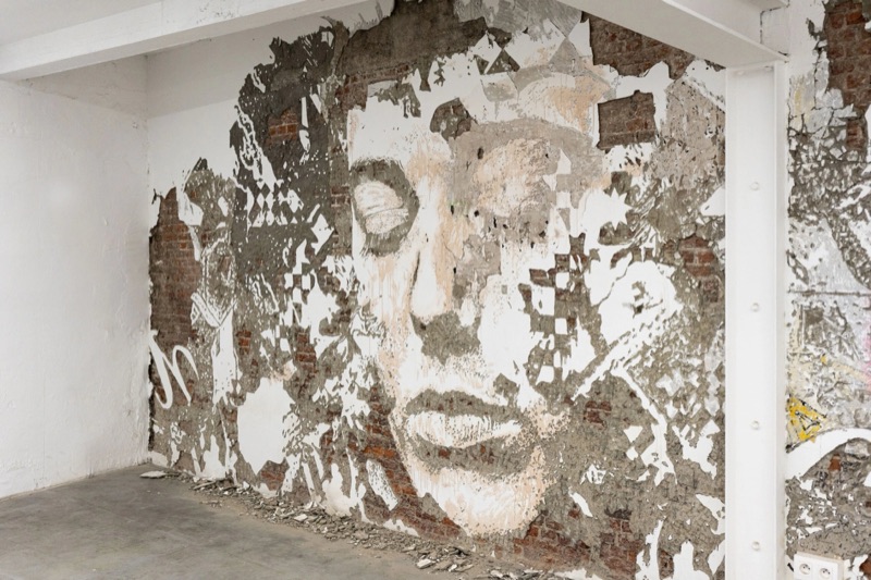 Carved brick-wall portrait at Multitude, MIMA Brussels