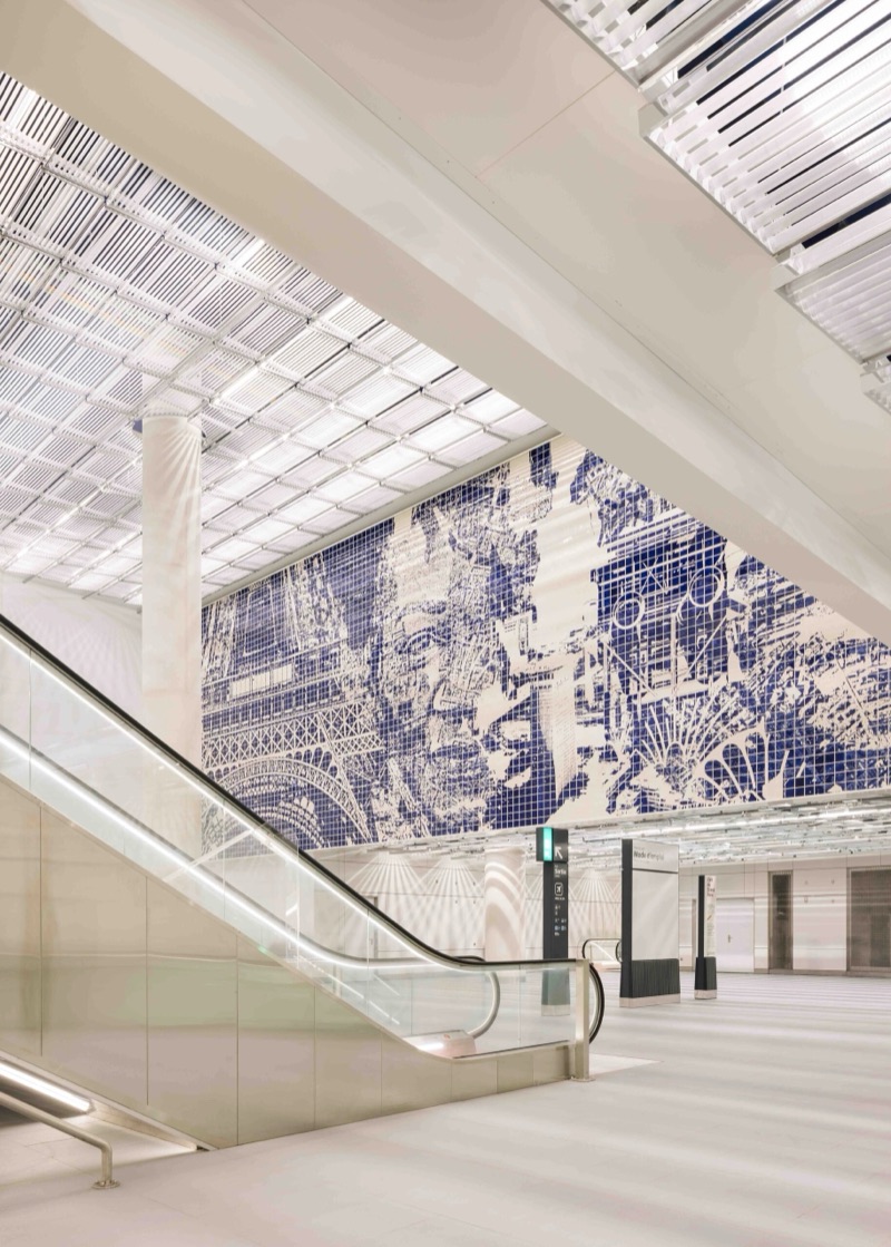 Angled view of the mural across the station concourse