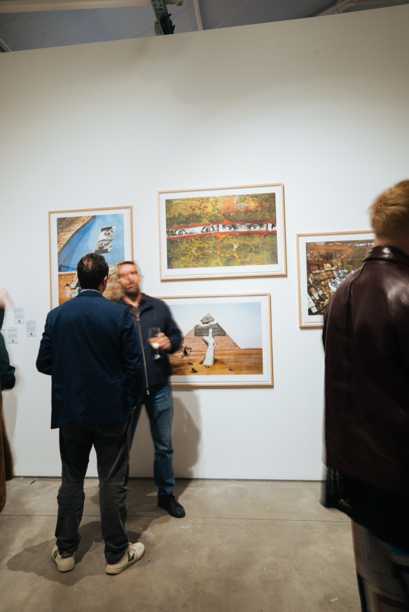 Framed works with visitors along the side wall, JR Through My Window, 2025