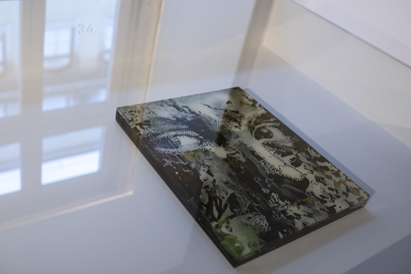 Vitrine detail with layered acrylic edition — Selected Editions at MUDE, Lisbon